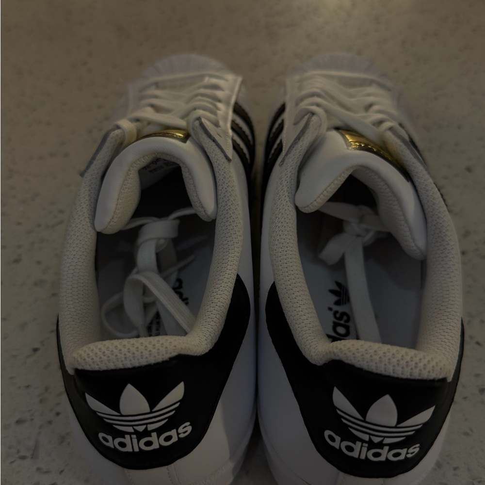 adidas Women’s White Sneakers with Black Stripes and Gold Tongue Logo - Picture 3 of 4